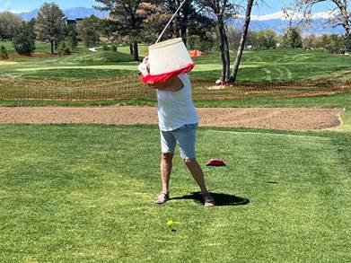 A person holding a bucket and a golf club

AI-generated content may be incorrect.